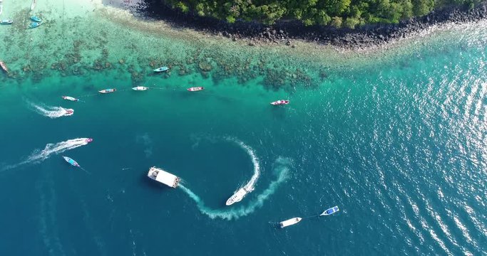 Aerial top view of long-tailed boat, speedboat is sail on the emerald s