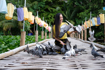 young asian woman relaxing on holiday at Bamboo bridge