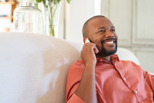 Mature african man talking on smartphone