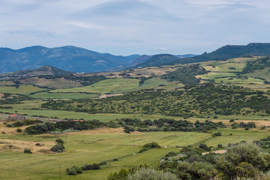 The village of Osilo, overlooking the fertile Anglona hills sloping down to the sea, province of Sassari , Sardinia, Italy.