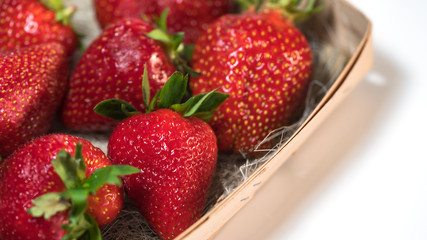 red strawberries lay on the table, harvest