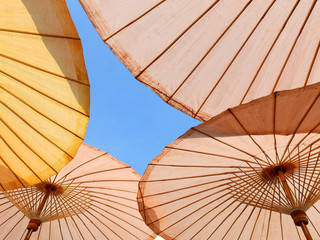 under of open umbrella with blue sky background