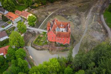 Cervena Lhota château. It stands at the middle of a lake on a rocky island. Its picturesque...