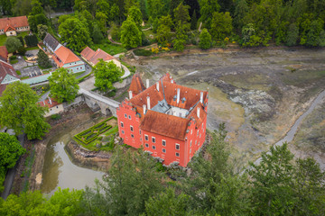 Cervena Lhota château. It stands at the middle of a lake on a rocky island. Its picturesque...