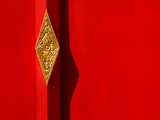 red wood door of temple Thailand