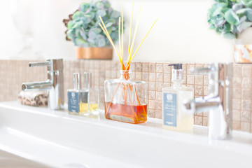 Silver faucet with aromatic bamboo sticks, perfume diffuser and