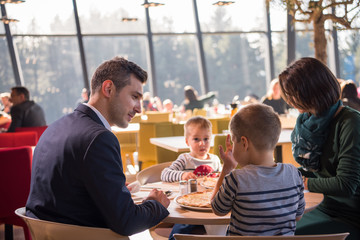 happy family enjoying lunch time together