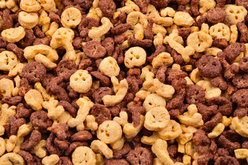  Chocolate flakes in the form of skulls and bones background. Top view.