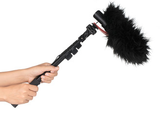 Hand holding A microphone boom isolated on white background © cloud7days