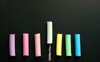 multicolored chalk on slate