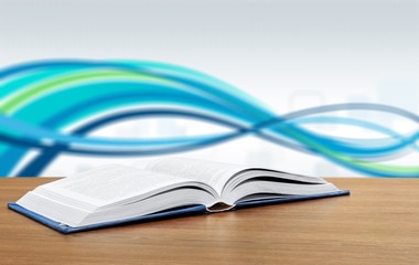Open book on the classic wooden table