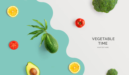 Creative layout made of avocado, tomato, lemon and broccoli. Flat lay. Food concept. Macro concept.