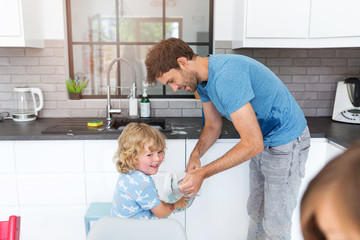 Fototapeta premium Father and son in kitchen