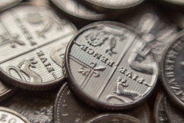 Pile of British 5 pence coins