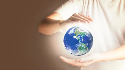 Hands Holding glowing global Earth, World in our hands, Love and care for our earth concept, , Elements of this image furnished by NASA