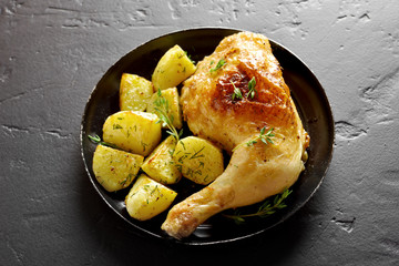 Baked chicken leg with potato