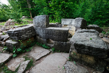 Ancient round ruined dolmen in the valley of the river Jean, Monument of archeology megalithic structure