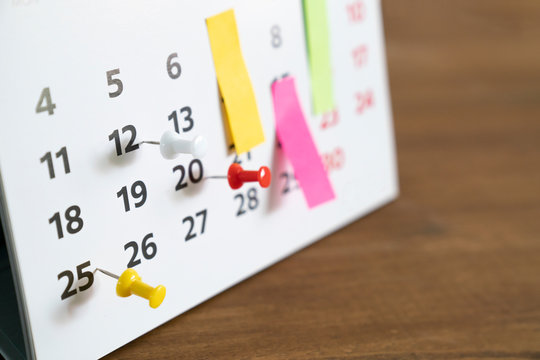 close up of calendar on the table, planning for business meeting or travel planning concept