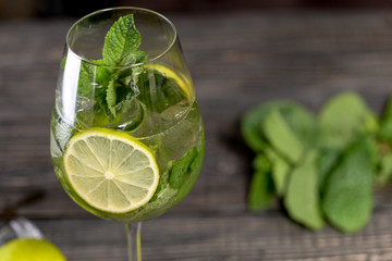 mojito cocktail on wooden background
