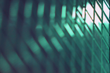 glass surface with a diamond-shaped geometric pattern in perspective, blurred image