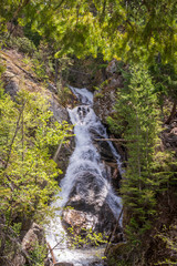 Nice creek  or small river in Vancouver, Canada. View with mountain background.