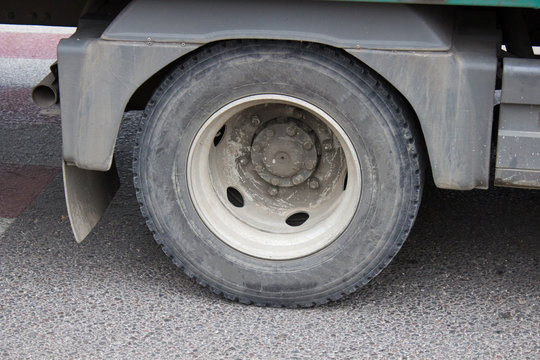 truck wheel on asphalt,Wheel of large truck and trailers,Close-up truck wheel on the road