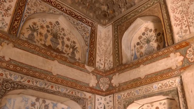 Pattern and ornate walls inside building of  the historical Red Fort of Agra, India. Shot in motion