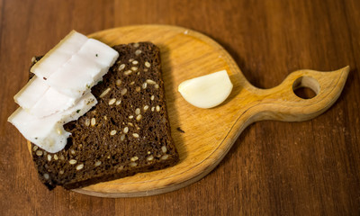 on a piece of black bread bacon garlic
