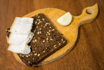 on a piece of black bread bacon garlic
