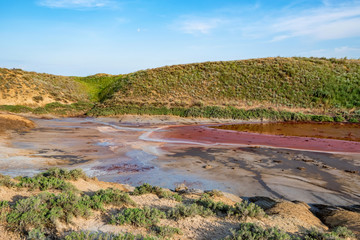 Red water lake full of iron in beautiful steppe