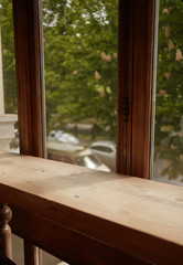 wooden empty table and the window on background