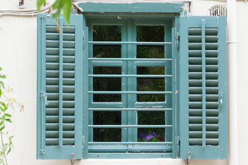 The window on the street of the Anafiotika district near the Acropolis in the city of Athens, Greece