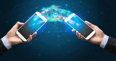 Two mobile phones syncing applications concept