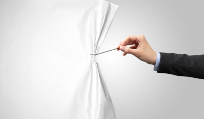 hand pulling white paper curtain, changing scene concept