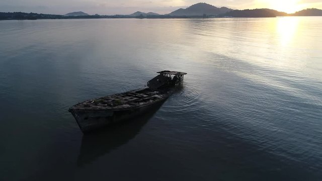 Aerial shot over a shipwrecked fishing boat near Phuket, Thailand