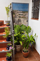 Tiles in hotel stairway painted with picture of Saint Peters Church Arcos de la Frontera Spain