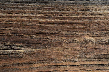The texture of the wooden pale brown boards