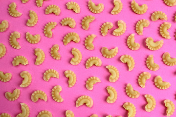 texture of pasta on a pink background