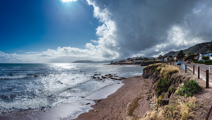 Clouds along the Pacific Ocean with embankments and the small city Pismo Beach, California, USA 