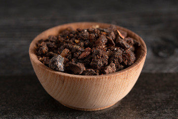 Bowl of Myrrh on a Dark Wood Table