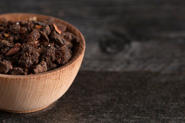 Bowl of Myrrh on a Dark Wood Table