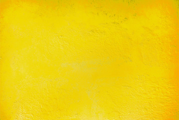 Textured relief plastered painted wall bright lemon yellow color