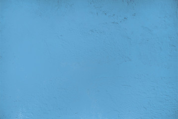 Textured relief plastered painted wall pale light blue color