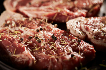 Obraz premium Raw steak meat with spice and herb