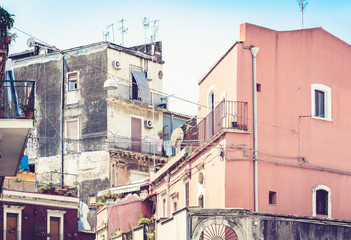 Fototapeta na wymiar Sicily, beautiful cityscape of Italy, historical street of Catania, facade of old buildings.
