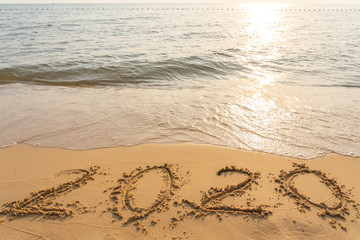 Happy New Year 2020 on the peaceful sand beach