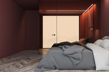 Side view of red master bedroom interior