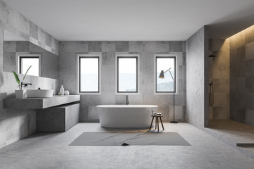 Gray tile bathroom interior, tub, sink and shower