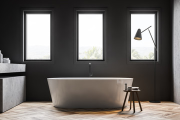 Gray bathroom interior with bathtub