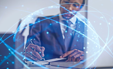 African American man in office, digital world